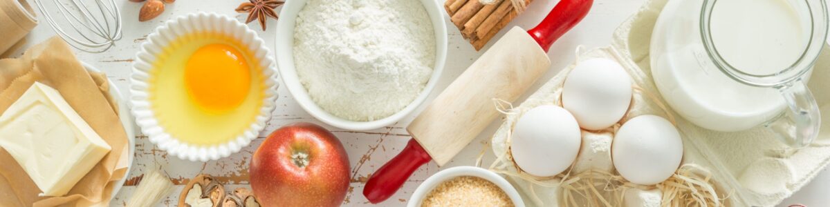 Baking ingredients background Baking ingredients on rustic background, top view, long format banner
